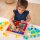Set of 100 colored and transparent acrylic cubes and a wooden mirror box