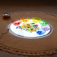 Set with 144 colorful, translucent plastic gems in a storage box